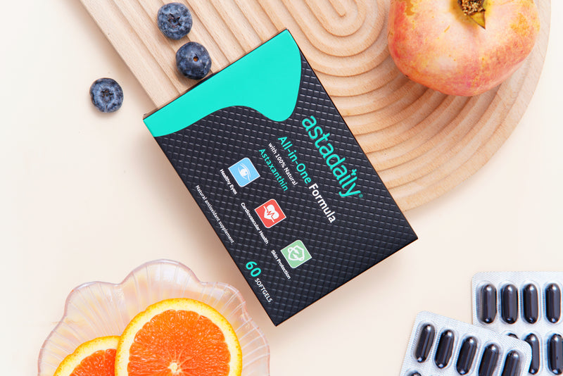 Astadaily astaxanthin antioxidant supplement with pomegranate, blueberries, and orange showing natural support for skin, eye, and heart health.